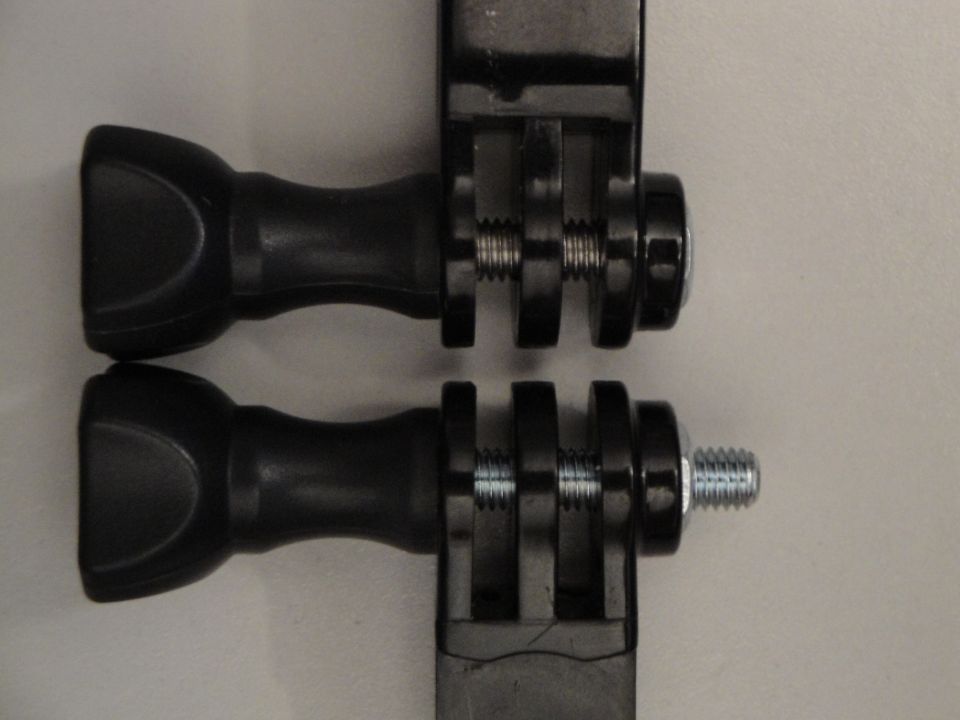 Two black plastic camera mounts with silver screws