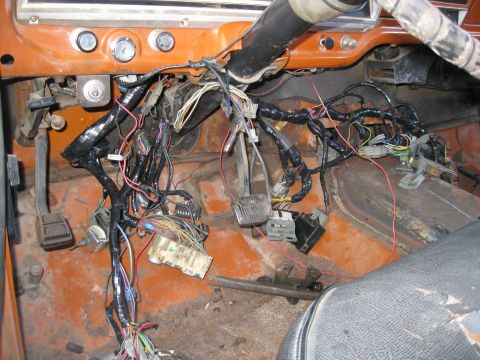 1969 Ford F-250 - The complex interior wiring harness is visible in this view of the dashboard and floor area.