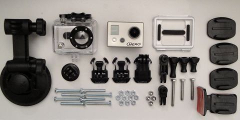 1993 Ford Taurus - A collection of GoPro camera equipment, including a camera, waterproof housing, and various mounting accessories.