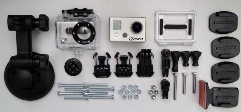 1993 Ford Taurus - A collection of GoPro camera accessories is laid out on a white surface.