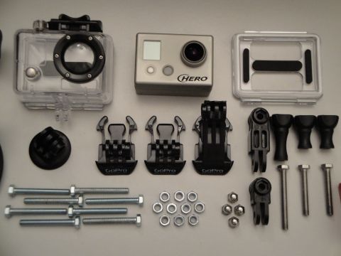 1993 Ford Taurus - GoPro HERO camera and assorted mounting accessories are laid out on a flat surface.