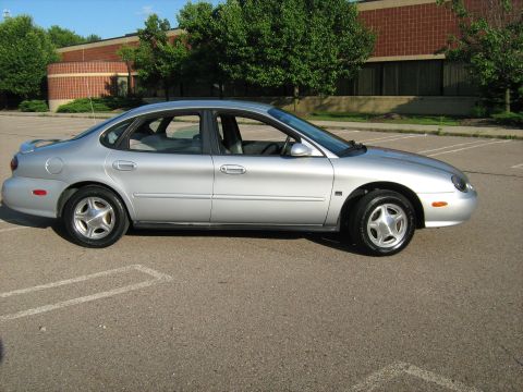 1988 Mercury Grand Marquis - This silver sedan is shown from the side in a parking lot.