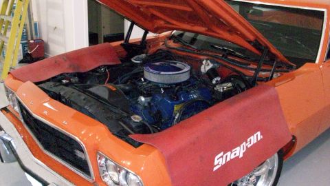 1973 Ford Ranchero - Engine bay of a 1973 Ford Ranchero, showing the blue engine block and air cleaner assembly.