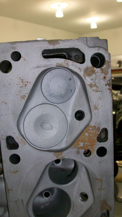 1973 Ford Ranchero - Close-up of an engine cylinder head, a visible Ford logo on one of the intake ports.