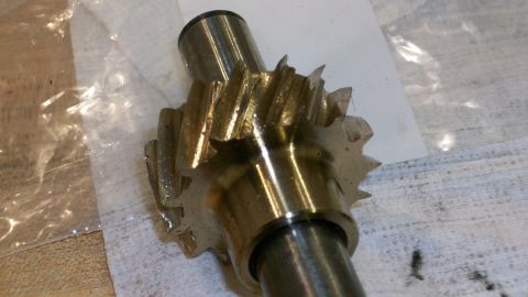 1973 Ford Ranchero - A close-up view of a damaged metal gear and shaft, likely an engine component.
