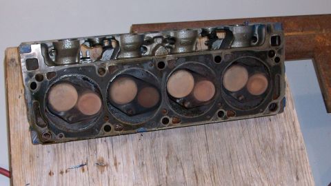 1973 Ford Ranchero - A close-up view of an engine's cylinder head, showing the intake and exhaust valves within their respective chambers.