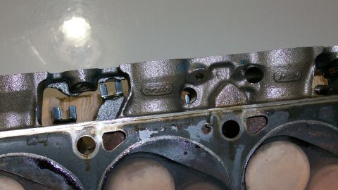 1973 Ford Ranchero - Close-up of an engine cylinder head, showing internal components and casting details.