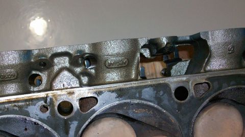 1973 Ford Ranchero - Close-up view of an engine cylinder head, showing internal components and casting details, with a SuperMotors watermark visible.