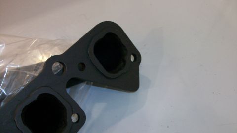 1973 Ford Ranchero - Close-up of an exhaust manifold gasket, showing its port openings.