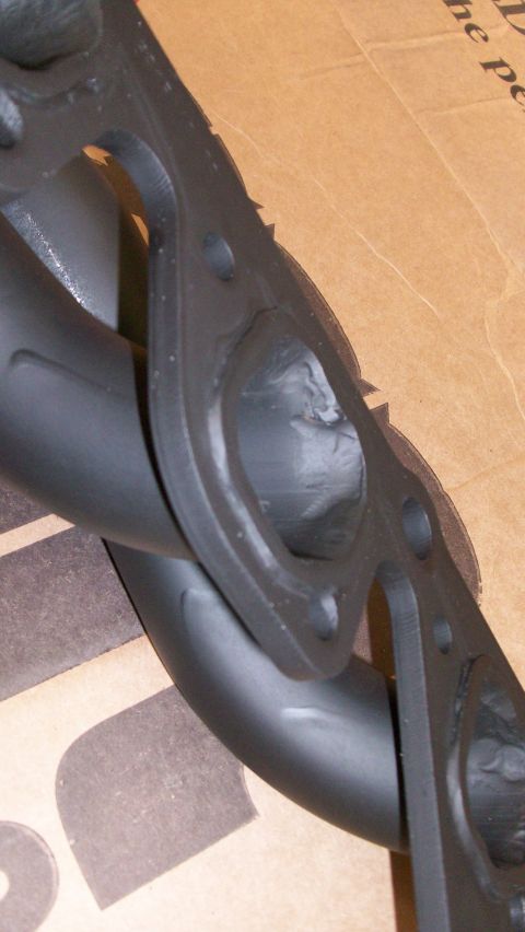1973 Ford Ranchero - Close-up of an exhaust manifold part, not a complete vehicle.