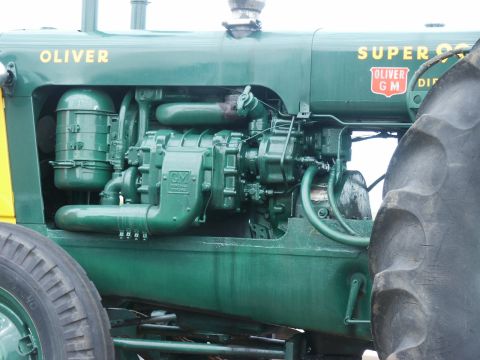 2000 Ford F-250 - Close-up of a green Oliver tractor's engine compartment, showing the 'SUPER 99 GM DIESEL' label.