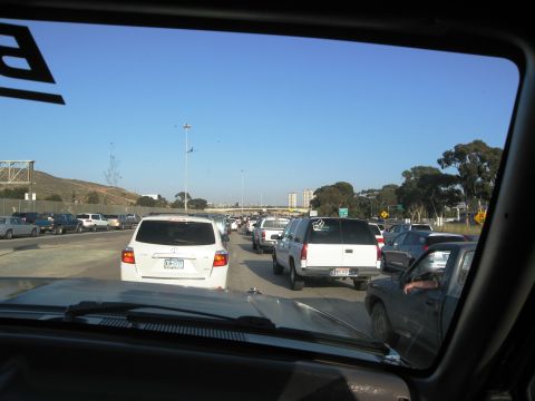 1986 Ford Bronco - View from inside a vehicle stuck in highway traffic on a clear day.