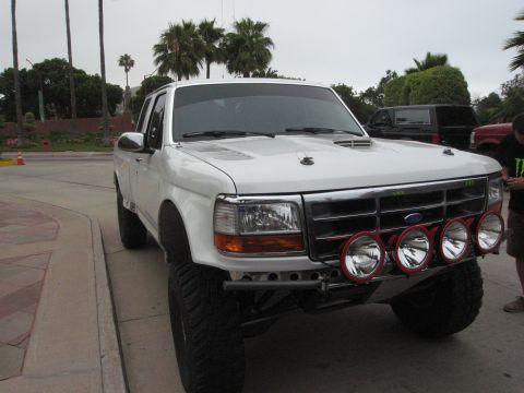 1986 Ford Bronco - This modified Ford pickup truck features auxiliary lights mounted on a custom bumper.