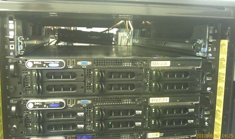 1985 Ford F-150 - A rack of Dell servers, some labeled 'MAGGIE' and 'KRISTY', are visible in a data center environment.