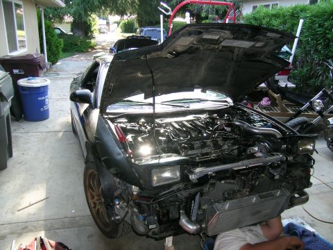 1995 Ford Probe - Front end of a 1995 Ford Probe disassembled for turbo build, exposing the engine and intercooler.