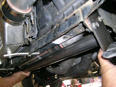 1995 Ford Probe - Custom exhaust system installation on a vehicle's undercarriage.