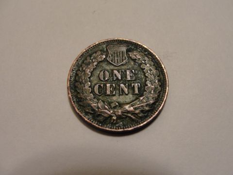 1995 Ford Bronco - This coin displays the words 'ONE CENT' surrounded by a laurel wreath and a shield emblem.