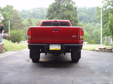 1997 Ford Ranger - Rear view of a red 1997 Ford Ranger pickup truck parked on a driveway.