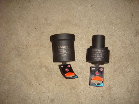 1992 Ford Bronco - Two Powerbuilt spindle nut sockets, one for 1-3/4 inch and another for 2-1/2 inch, are displayed on a concrete floor.