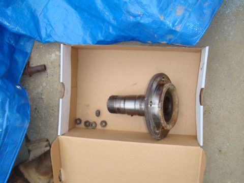 1992 Ford Bronco - A disassembled vehicle axle component and associated hardware are laid out in a cardboard box.