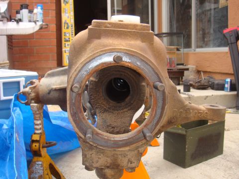 1992 Ford Bronco - A rusty front axle housing, possibly from a Ford Bronco, is shown with a visible part number.