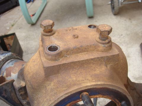 1992 Ford Bronco - Close-up of a rusty differential housing, likely a vehicle part.
