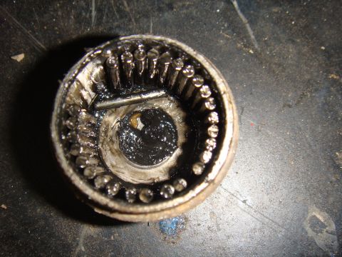 1992 Ford Bronco - This image shows a damaged wheel bearing assembly, likely needing replacement.