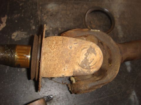1992 Ford Bronco - Rusty driveshaft universal joint, likely from an older vehicle.