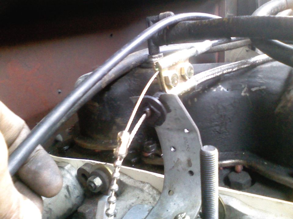 ((The gold bracket is for an aftermarket cruise control kit.))