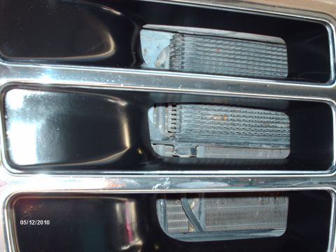 Grille with three openings showing oil coolers