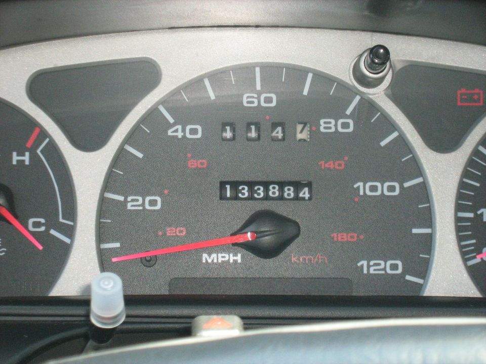 Vehicle instrument cluster showing speedometer and odometer at 133884 miles