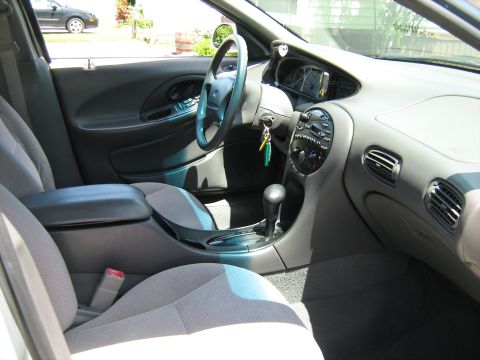 1988 Mercury Grand Marquis - The interior of a car is shown, the dashboard, steering wheel, and seats.
