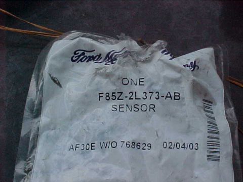 1995 Ford Bronco - A Ford branded sensor part is shown in its packaging, with a part number and date visible.