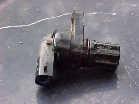 1995 Ford Bronco - A crankshaft position sensor, a critical engine component, is shown in detail.