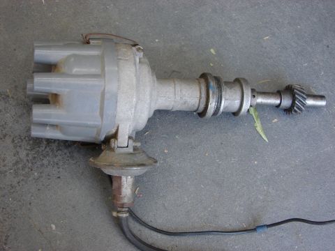 1978 Ford Bronco - This is a close-up view of an automotive distributor, a key component in older ignition systems.