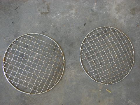 1978 Ford Bronco - Two circular wire mesh grilles are shown on a concrete floor.