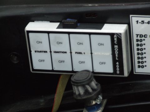1990 Ford Mustang - An aftermarket switch panel with multiple ON/OFF toggles for various vehicle functions is visible.