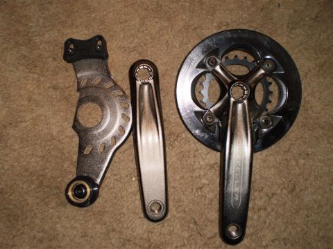 1978 Ford Bronco - These bicycle components are laid out on a carpeted surface.