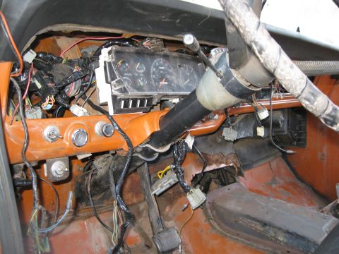 1969 Ford F-250 - Exposed wiring and components are visible within the vehicle's dashboard area.