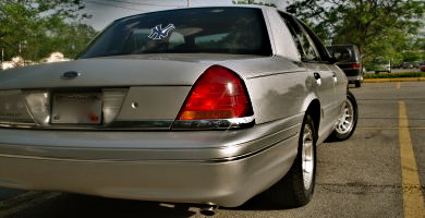 2000 Ford Crown Victoria - This silver 2000 Ford Crown Victoria sedan is seen from the rear in a parking lot.