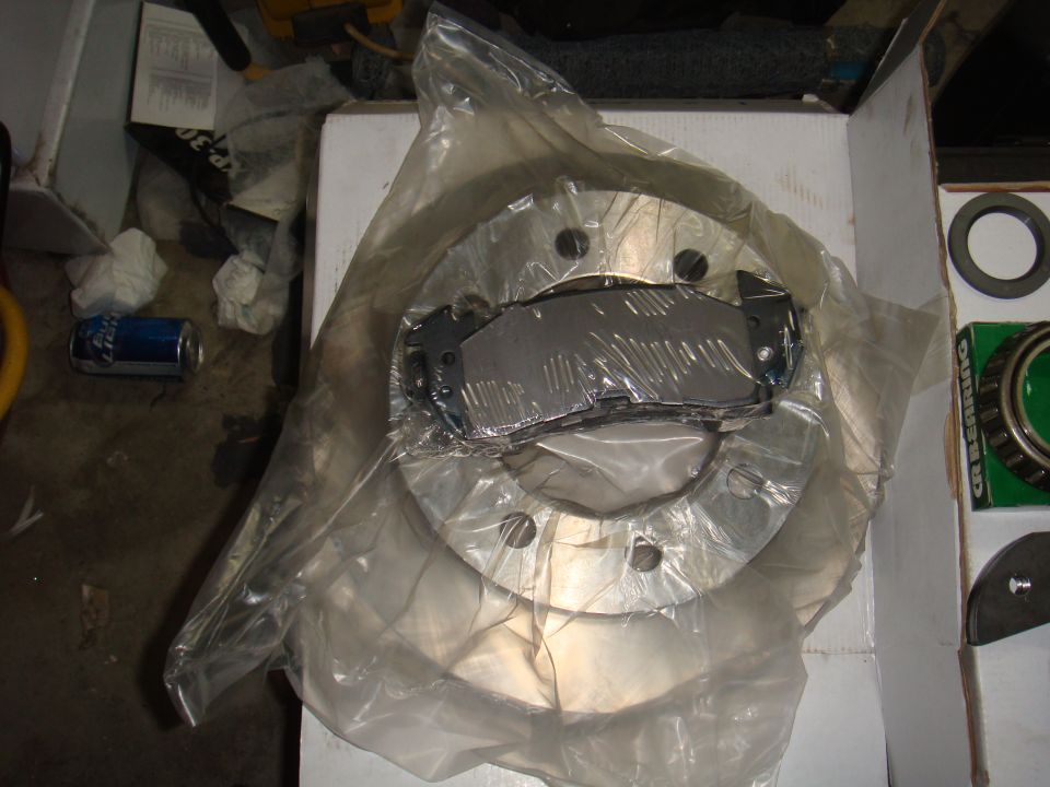 Brake rotor and pads in plastic packaging