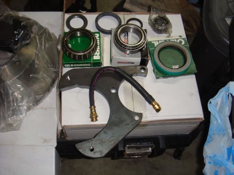 1992 Ford Bronco - Various vehicle brake components are displayed, including a rotor, bearings, and a brake line.