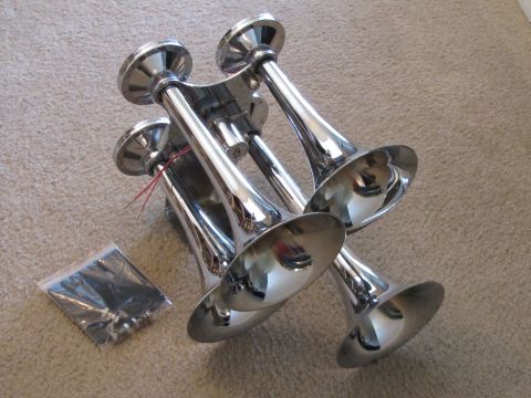 1995 Ford Bronco - Four chrome train horns are shown with a small bag of wiring and connectors.