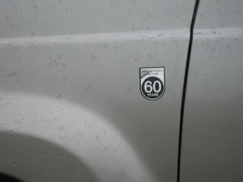 2001 Jeep Grand Cherokee - A close-up of a vehicle's side panel shows an anniversary edition badge with "60 Years" text.