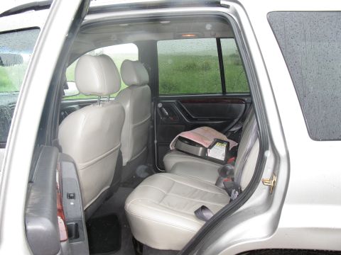 2001 Jeep Grand Cherokee - Rear interior of a 2001 Jeep Grand Cherokee, leather seats and a child seat installed.