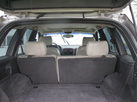 2001 Jeep Grand Cherokee - Interior view of the cargo space and rear seating area of a Jeep Grand Cherokee.