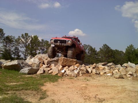1979 Ford Bronco - Modified 1979 Ford Bronco navigating a challenging rock obstacle course.