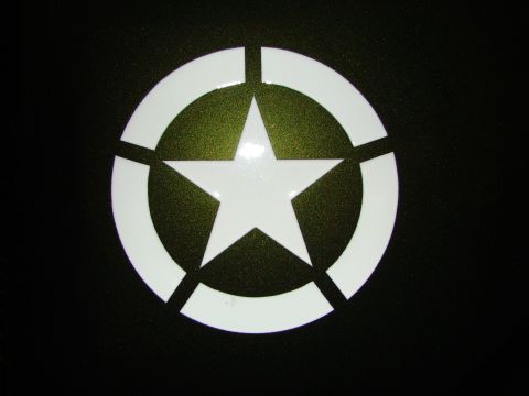 1948 Jeep Wrangler - A white star emblem with a circle and bars is visible on a dark surface.