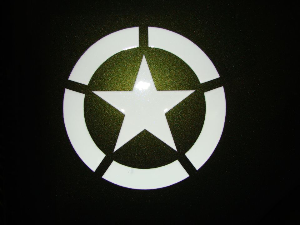 White military star emblem on a dark background