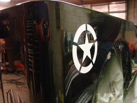 1948 Jeep Wrangler - A close-up view of a vehicle's fender, a prominent white star decal.